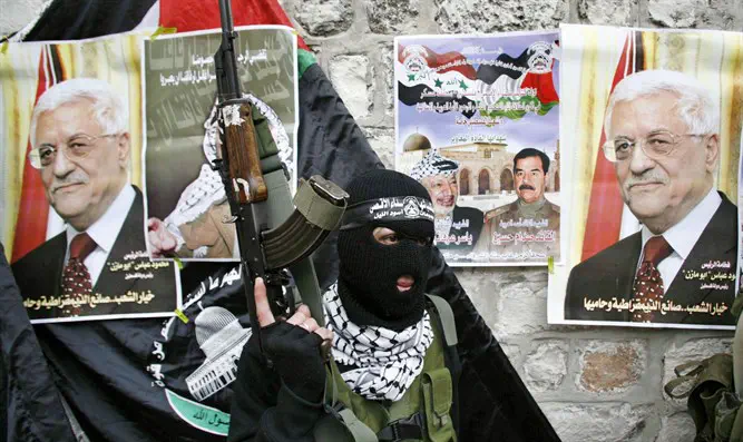 Fatah Al-Aqsa Martyrs Brigade terrorist with Mahmoud Abbas's picture