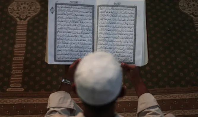 Muslim reads Koran