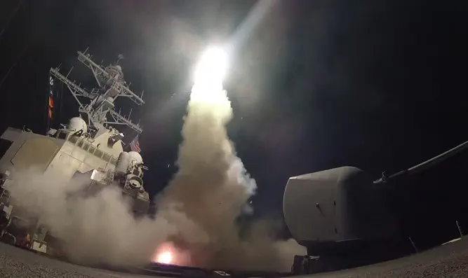The USS Porter firing a Tomahawk missile at a Syrian military airfield in the Mediterranean Sea