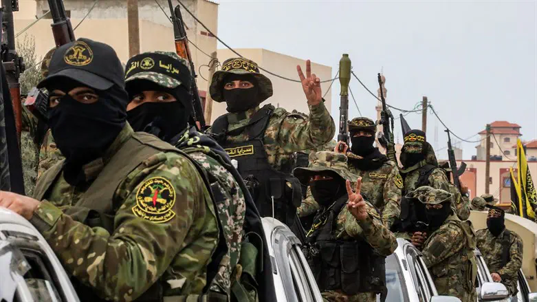 Members of Islamic Jihad's military wing take part in military parade in Gaza