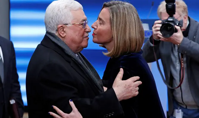Mahmoud Abbas is greeted by EU foreign affairs chief Federica Mogherini
