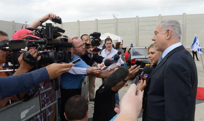 Prime Minister Netanyahu talks to reporters before flying to New York