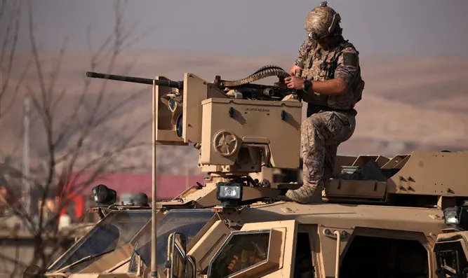 American soldier on armored vehicle in Iraq